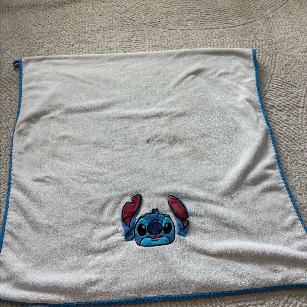 White Blanket with Blue Character Design